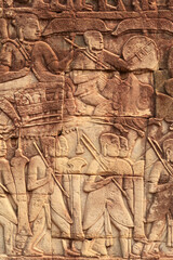 A bas relief, bas-relief, stone carving on a wall of the Bayon Temple, elephant and warriors, Angkor Wat, Siem Reap, Cambodia