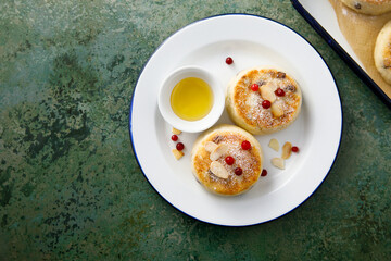 Homemade curd cakes with honey and almond