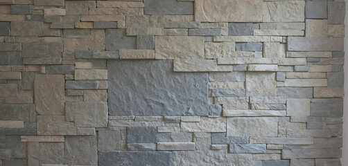 Fototapeta premium Apply stone or brick veneer to your wall to create a textured and realistic 3D effect. This is perfect for rustic or industrial designs.