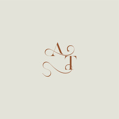 monogram wedding style logo concept initial with thin line AT contemporary modern curvy letter