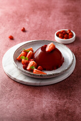 Homemade strawberry jelly with fresh berries