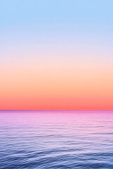 Fototapeta premium Smooth gradient sky shifting from warm orange at the horizon to pale lavender overhead, with a dark