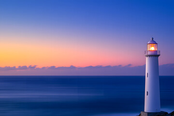 Majestic Sunrise at Coastal Lighthouse with Serene Ocean View  
