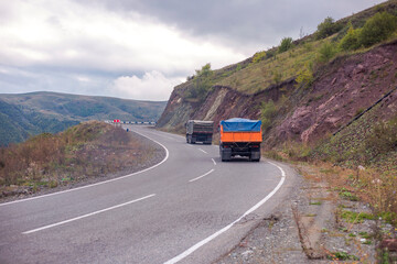 Brand new dump truck in road.