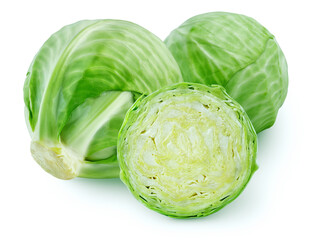 Isolated green cabbages. Two whole and a slice of green cabbage isolated on white background