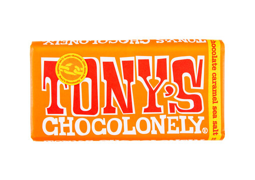 LONDON, UK - DECEMBER 27, 2024: Large bar of Tony's milk chocolate with sea salt caramel on white background.