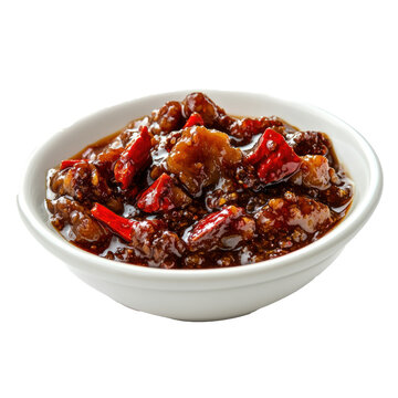 Close-up of a small dish filled with Chinese XO sauce, featuring chili, dried scallops, and rich umami flavors, served in a ceramic bowl.  
