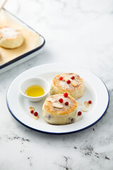 Homemade curd cakes with honey and almond