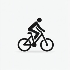 Fototapeta premium Cyclist riding through a clear park path on a sunny day enjoying outdoor exercise and leisure activities