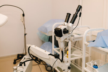 Colposcope for detail examination of disease. Gynecologist does colposcopy procedure to closely examine cervix, vagina and vulva of girl in gynecology clinic.