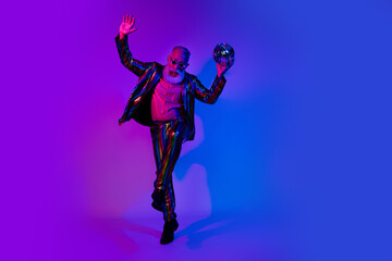 Full length photo of grandpa discoball dance dressed colorful sequins striped party clothes isolated on blue purple neon light background