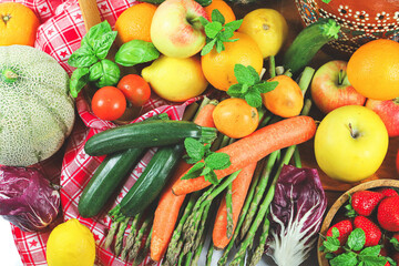 rustic composition of mixed fruits and vegetables viewed from above