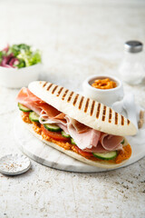 Grilled sandwich with prosciutto and vegetables