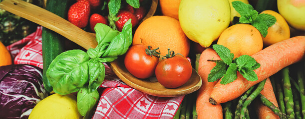 rustic composition of mixed fruits and vegetables viewed from above
