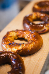 Freshly baked bagel with cherries in a bakery on a display window.