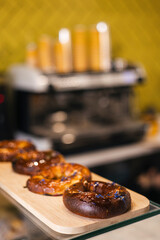 Freshly baked bagel with cherries in a bakery on a display window.