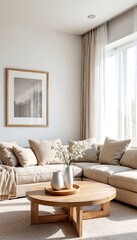 Simple living room with white walls and light wood furniture.