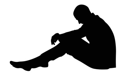 Silhouette of a person sitting with head down in contemplation