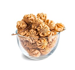 Dried longan fruit in glass bowl isolated on white background