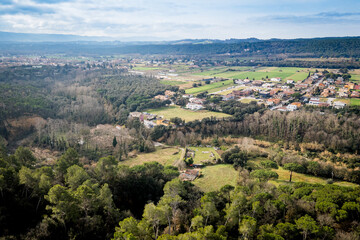 Fototapeta premium Panoramic aerial view of catalan countryside landscape outside of Barcelona. Small towns in Catalonia, Spain