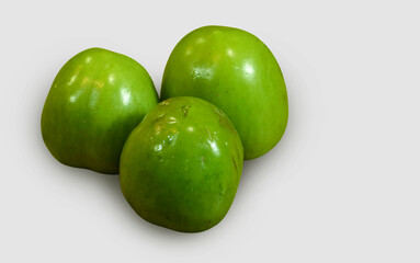 green tomatoes isolated on white background
