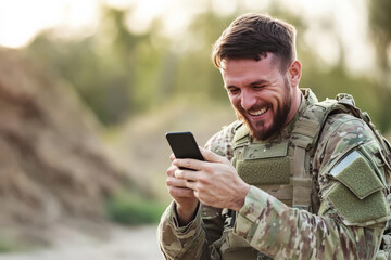 A soldier on duty, opening his phone to find a sweet surprise video message from his spouse, his face softening with emotion.
