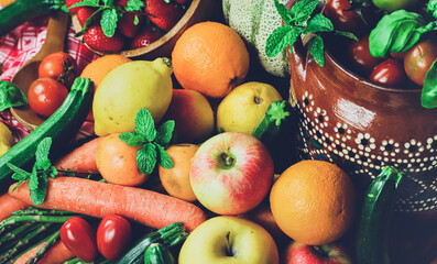 rustic composition of mixed fruits and vegetables viewed from above