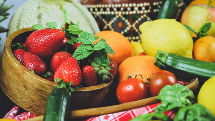 rustic composition of mixed fruits and vegetables viewed from above