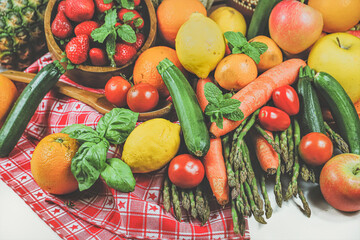 rustic composition of mixed fruits and vegetables viewed from above