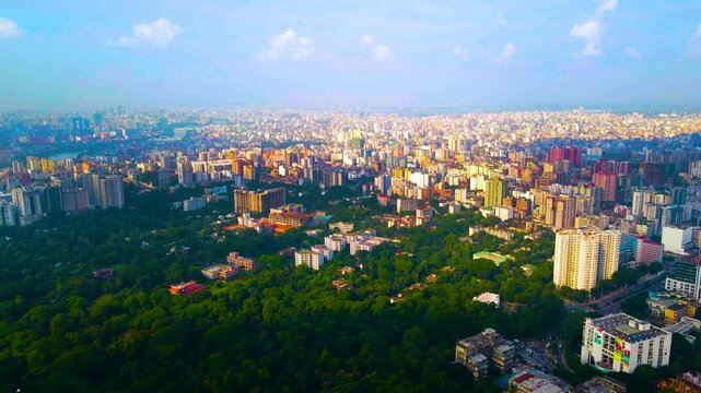 Aerial of green trees at Ranma Park with expansive cityscape, Dhaka, Bangladesh