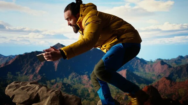 Foolish hiker acting careless dropping smartphone and losing balance, person unequipped for the harsh mountain environment. Risks of trekking with a technology obsession in nature. Camera A.