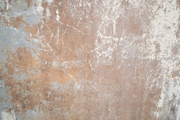 A textured pattern on a cement wall, showcasing its rough, uneven surface and industrial aesthetic