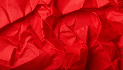 Fototapeta premium Bright red crumbled paper texture background. Natural crinkles and creases. Abstract design. Closeup