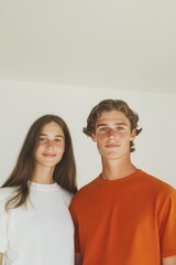 Bright, cheerful portrait showcasing two young individuals in ca