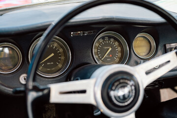 Close-Up of a Classic Car Dashboard with Speedometer and Gauges