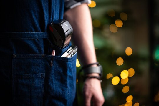 Waiter With Wireless Terminal In Pocket Of Apron