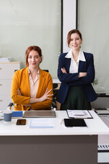 Portrait of a successful business woman with inspiration from their excellent financial results front at the desk, looking to camera.