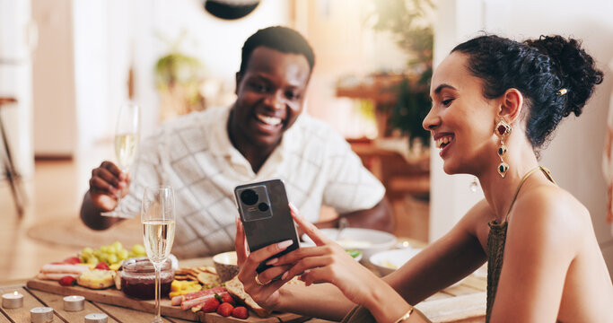 Couple, video call and happy at lunch in home, toast or champagne for chat on valentines day. Phone, man and woman with live stream, food and cheers with interracial love for post on social media