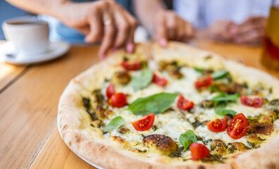 Girl Taking A Piece Of Vegetarian Pizza At The Cafe