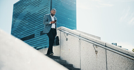 Black man, walking and stairs with phone for commute, business trip or corporate travel in city....