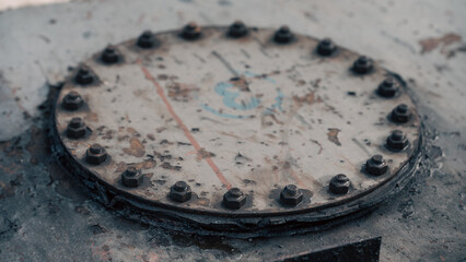 iron hatch closed with many bolts