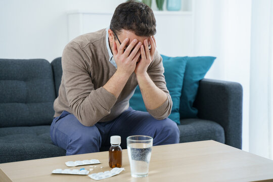 One man fighting cephalalgia with pills meds