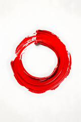 Red lipstick or paint circle sample smear isolated on white background