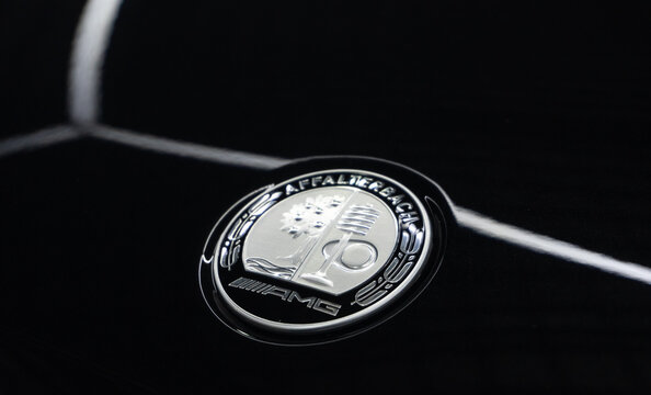 AMG Affalterbach logo on a black background, close-up. AMG Affalterbach nameplate on the hood of the luxury Mercedes-Benz S63 S-class W223 V8 biturbo. 
