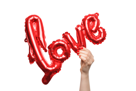 Woman's hand holding red foil balloon with word love, isolated