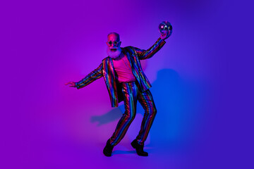 Full length photo of grandpa dance discoball dressed colorful sequins striped party clothes isolated on blue purple neon light background