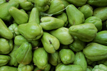 Fresh, ripe green chayote (Labu Siam) with smooth skin and firm texture, showcasing its natural freshness and vibrant color