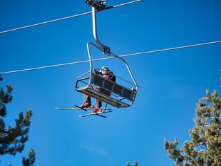 Chairlifts that go to the top of the ski resort so that skiers and snowboarders can start the descent of the slope. Concept snow, sport, resort, winter.