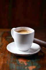 Cup of coffee on wooden background. Soft focus. Copy space