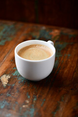 Cup of coffee on wooden background. Soft focus. Copy space